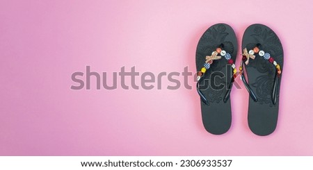 pair of flip flops isolated on pink background. Close-up of beach slippers. Future vacation. blank for design. horizontal image. Banner for insertion into site.