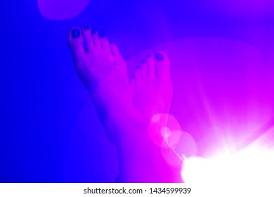 A pair the foot dark blue color background and pink halo  effect  The creative concept for leaflet other ideas