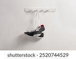 Pair of football cleats hanging on a wall