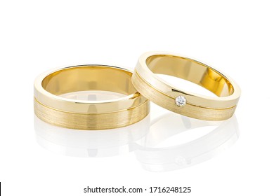 Pair Of Gold Wedding Rings Isolated On White Background. Yellow Gold Ring Bands With Combined Glossy And Textured Surface