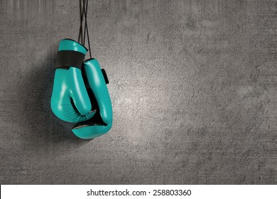 Pair Of Green Boxing Gloves Hanging On All