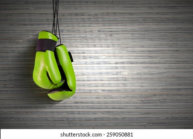 Pair Of Green Boxing Gloves Hanging On All