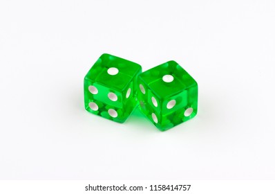 A Pair Of Green, Translucent Gaming Dice On A White Background With Their Spots Showing A Pair Of Ones, Or Unlucky Snake Eyes As In A Losing Game Of Craps In A Casino.