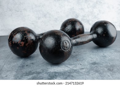 Pair Of Heavy Bar Bells On Marbe Background