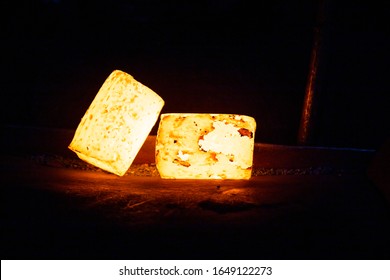 a pair of heavy hot glowing cylindrical workpieces ready to forging on dark metal background - Powered by Shutterstock