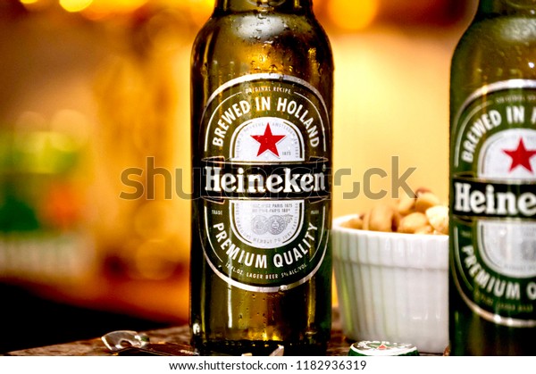 Pair Heineken Beer Bottles Bowl Mixed Food And Drink Stock Image