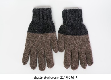 Pair Of Knitted Gray Wool Gloves Isolated On A White Background.