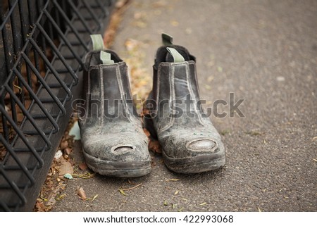 Pair of Labourers Work Boots left abandoned on a city sidewalk