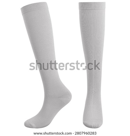 Pair of light gray knee-high compression socks isolated on a white background with front and side views