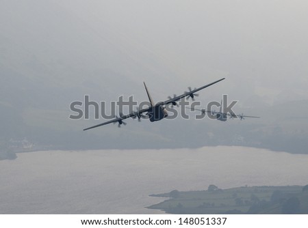 A pair of Lockheed Martin C-130J-30 Hercules C Mk.4 of the Royal Air Force seen low level in Wales as it approaches the Cader Idris pass from Cad East, Machynlleth Loop. Looking towards Lake Tal-y-Lyn