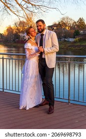 Pair Of Lovers In Park Near River. Wedding. Husband And Wife. Bride And Groom. Average Age. Moscow 30 October 2021