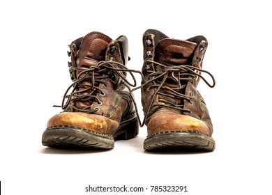 Pair of Men's Dirty Grungy Beat Up Brown Leather Work Boots with Long Laces Isolated on White Background