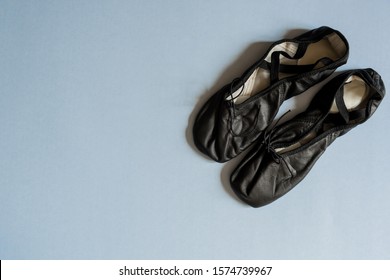 A Pair Of Men's Leather Ballet Shoes Isolated On Blue.