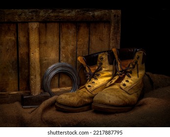 Pair Of Men's Old Leather Work Boots With Objects. Still Life.