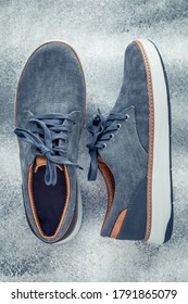 A Pair Of Men's Shoes On A Gray Background. Mens Lace-up Sneakers, Top View. Casual Style Concept.
