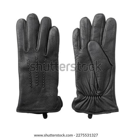 A pair of men's winter black leather gloves close-up lie next to each other. Front and back side. Isolated on white background.