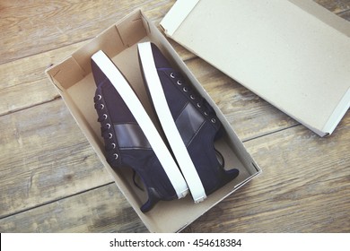 A Pair Of New Blue Shoes In A Shoe Box