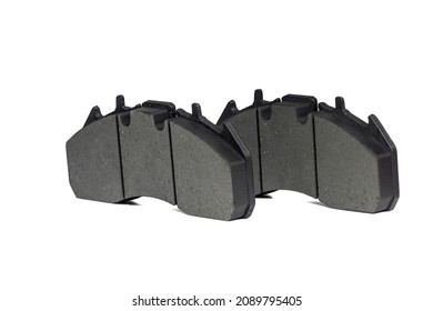 A pair of new brake pads on isolated white background - Shutterstock ID 2089795405