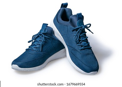 Pair of new dark blue sneakers isolated on white background.