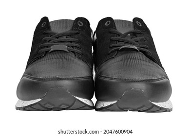 Pair Of New Non-branded Black Athletic Trainers Or Trainers Isolated On White Background. File Contains Clipping Path. Full Depth Of Field. Insulated Footwear.