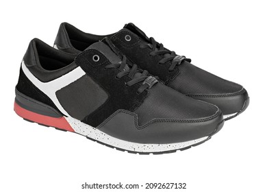 Pair Of New Non-branded Black Athletic Trainers Or Trainers Isolated On White Background. File Contains Clipping Path. Full Depth Of Field. Insulated Footwear.