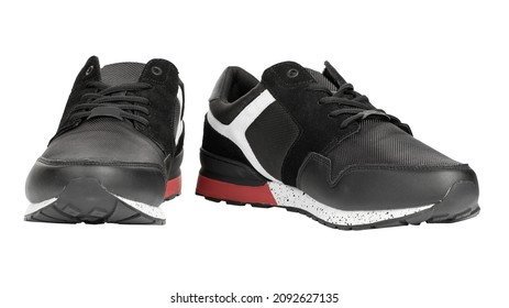 Pair Of New Non-branded Black Athletic Trainers Or Trainers Isolated On White Background. File Contains Clipping Path. Full Depth Of Field. Insulated Footwear.