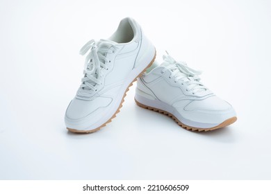 Pair Of New Professional White Sneakers Over White Background. Horizontal Image