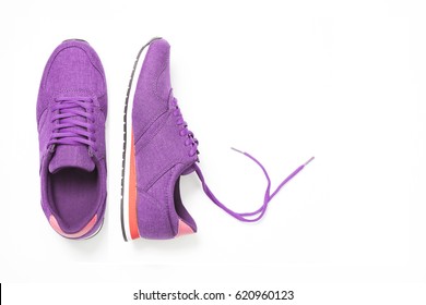 pair of new purple sneakers isolated on white background.