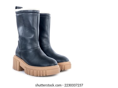 A Pair of New Women's Chunky Heel Black Winter Boots Lined with Faux Fur Isolated on White - Powered by Shutterstock