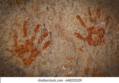 A Pair Of Ochre Hands, Red, Orange, Yellow Handprints On A Rock, Aboriginal Art In Queensland, Australia.