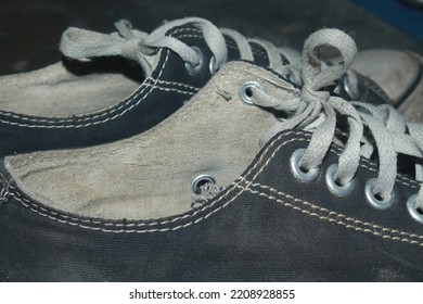 A Pair Of Old And Almost Broken Shoes


