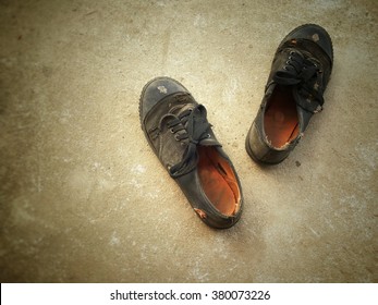 Pair Of Old Black Shoes For School On Cement Background, Vintage Tone, Back To School Concept