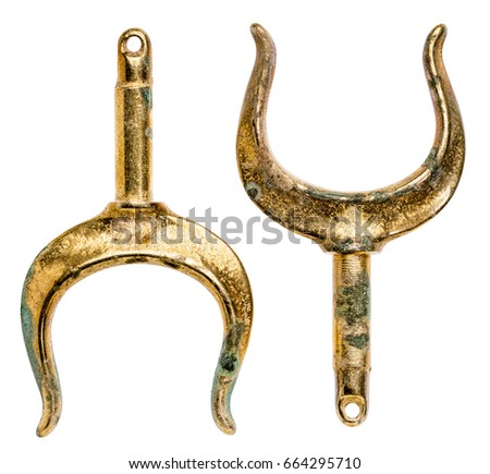 a pair of old brass rowlocks (oarlocks) isolated on white