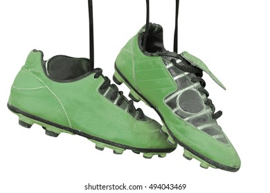 A Pair Of Old Football Boots On White Background