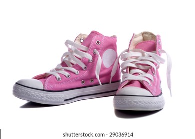 A Pair Of Pink Sneakers Or Basketball Shoes On A White Background