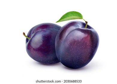 Pair of purple Plums with leaf isolated on white background.