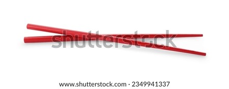 Pair of red chopsticks isolated on white