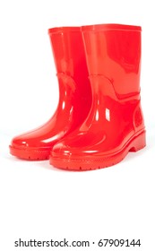 A Pair Of Red Rainboots On A White Background