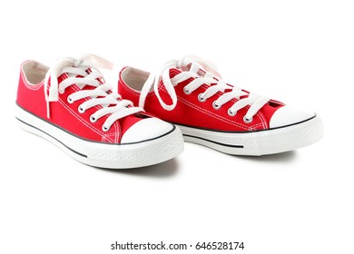 Pair Of Red Sneakers Isolated On A White