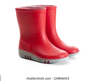 Pair Of Red Wellies In Kids Size. Tilted Side View. Studio Shot, Isolated On White Background.