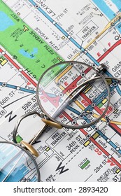 Pair Of Rimmed Glasses Over NYC Subway Map