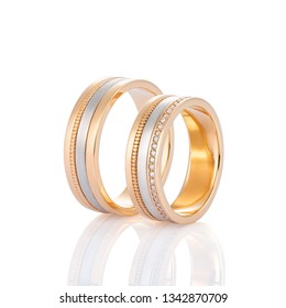 Pair Of Rose Gold And White Gold Wedding Ring With Diamonds Isolated On White Background. Silver And Gold Wedding Fashion Jewelry