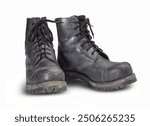 Pair of rundown combat boots in white back with shadow