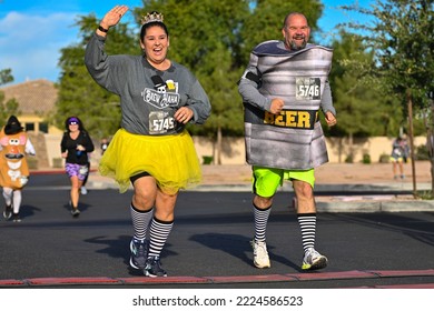 A Pair Of Runners In Halloween Costumes Cross The Finish Line At The Brew HaHa 5k Race On Oct. 30, 2022. 