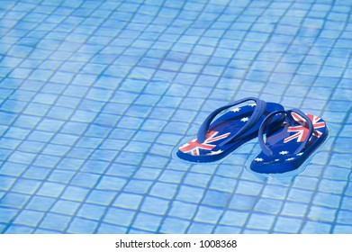 Pair Of Sandals Printed With The Australian Flag Floating On A Pool.