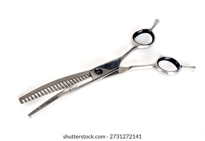 pair of scissors in front of white background