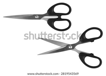 A pair of scissors, shown both closed and open, isolated on a white background.