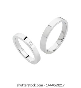 Pair Of Silver Wedding Rings Isolated On White Background. White Gold Ring Bands With Diamonds On Female Ring