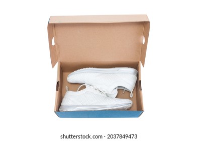 Pair Of Sneakers Inside Shoe Box On White Background