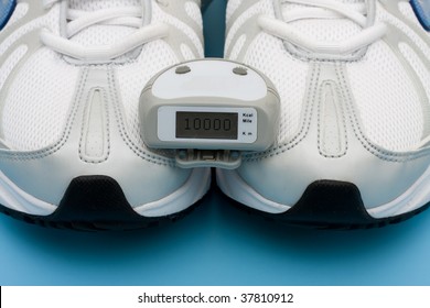 A Pair Of Sneakers And A Pedometer On A Blue Background, Walking For A Healthy Heart